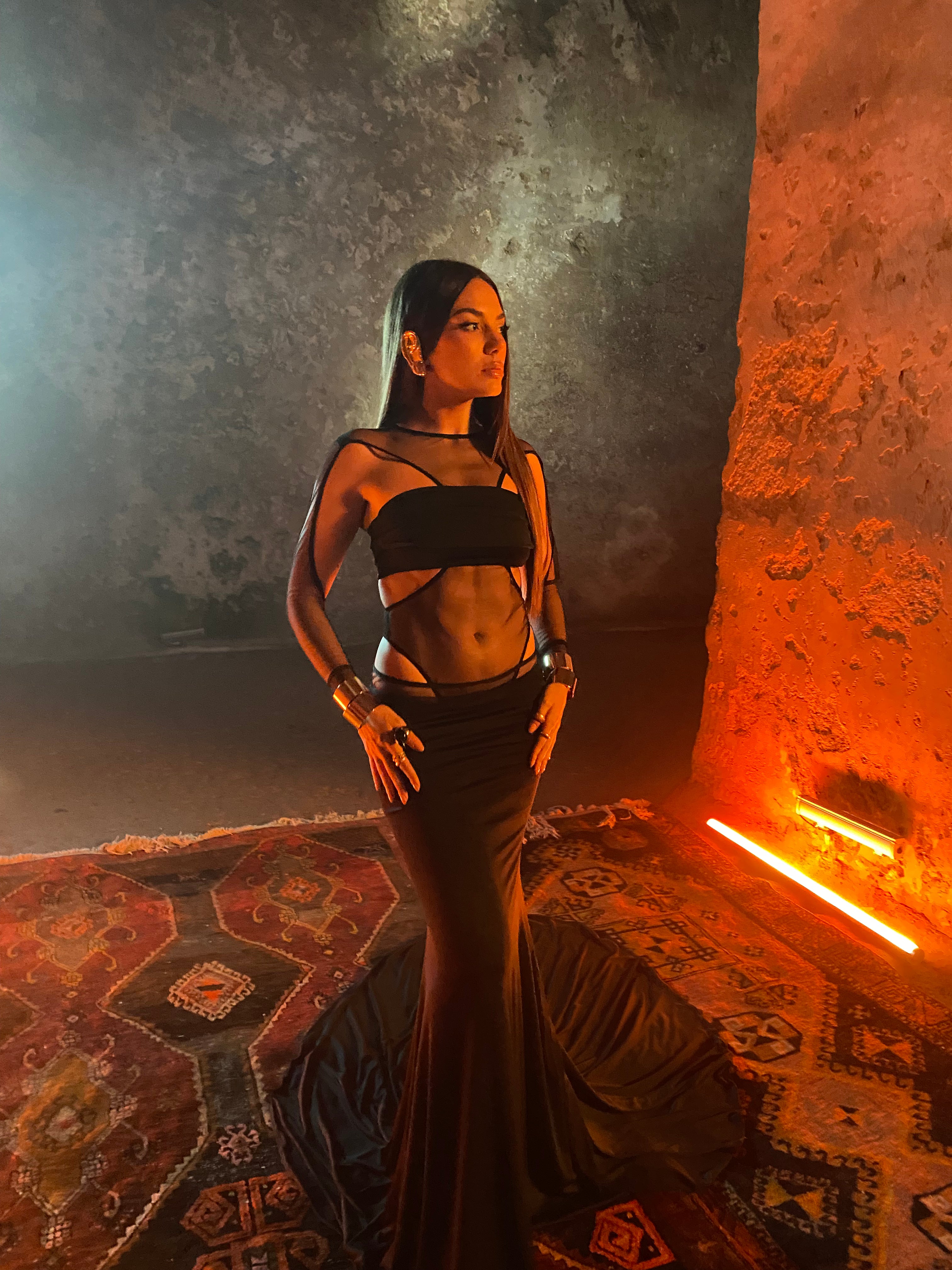 Singer Elvana Gjata styled in a goddess like all black outfit styled by fashion stylist Monda Kul.